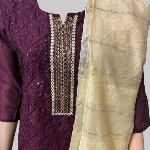 Purple and beige traditional outfit with intricate patterns on a white background