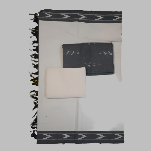 Black and white patterned fabric with folded black and white items on a white background