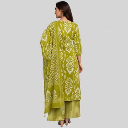 Woman wearing a green patterned outfit on a gray background