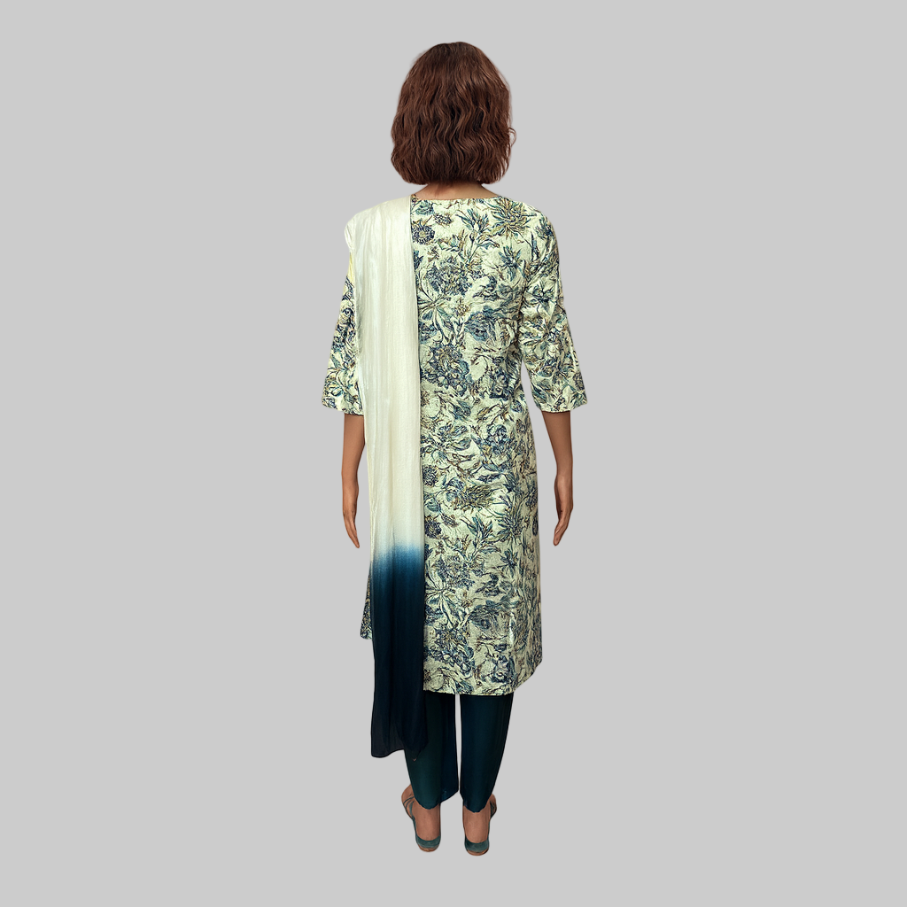 Woman wearing a floral kurta with a matching dupatta on a gray background