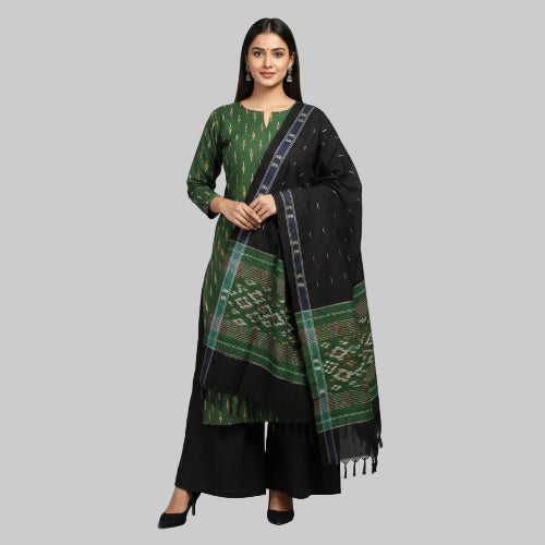 Green and black fabric with patterns on a floral-patterned surface