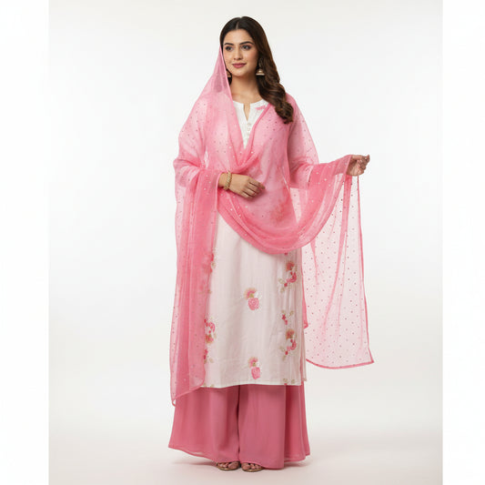 Woman wearing a pink and white traditional outfit with a matching dupatta on a white background