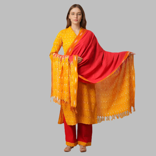 Woman wearing a yellow and red traditional outfit with a matching dupatta on a white background