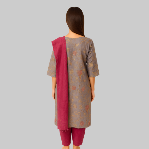 Woman wearing a traditional outfit with a gray top and maroon dupatta on a white background