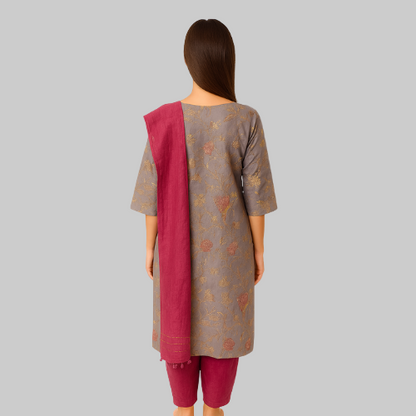 Woman wearing a traditional outfit with a gray top and maroon dupatta on a white background