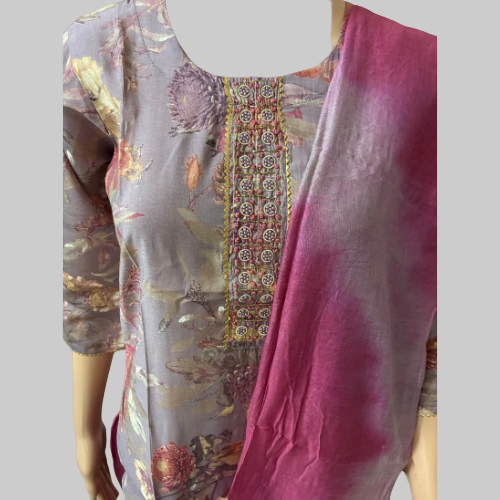 Mannequin wearing a floral-patterned kurta with a pink dupatta on a white background