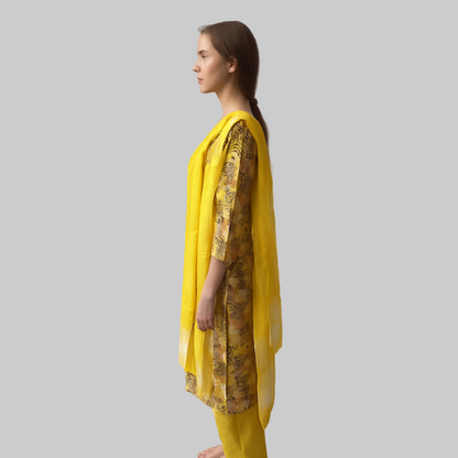 Woman wearing a yellow traditional outfit with a patterned top on a white background