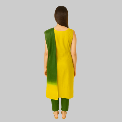 Woman wearing a yellow and green dress with a white background