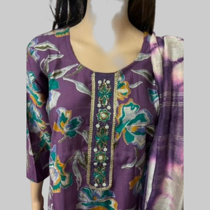 Purple floral embroidered dress on a mannequin with a white background