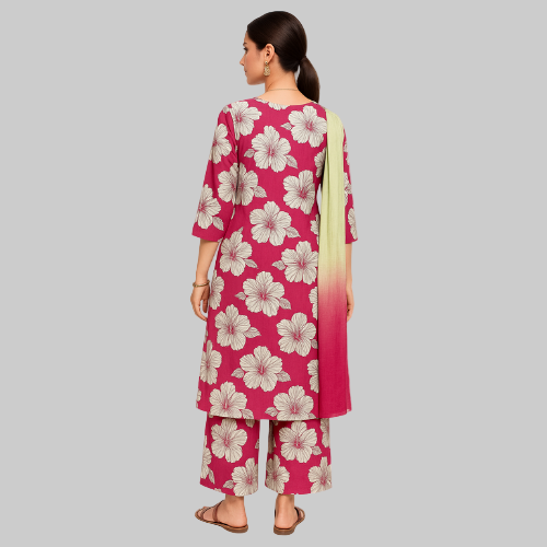 Woman wearing a pink floral outfit on a white background