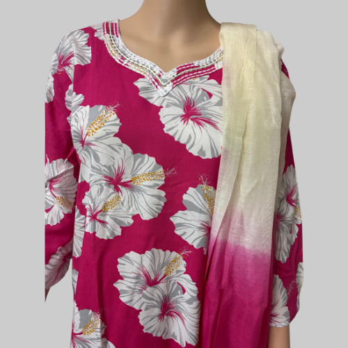 Pink floral dress with a white dupatta on a mannequin against a white background