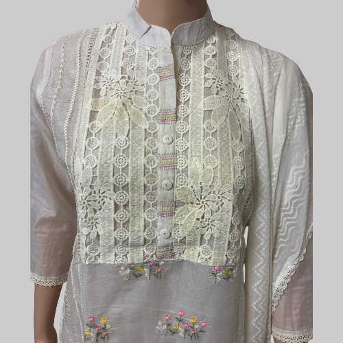 Traditional embroidered white outfit on a mannequin with a white background