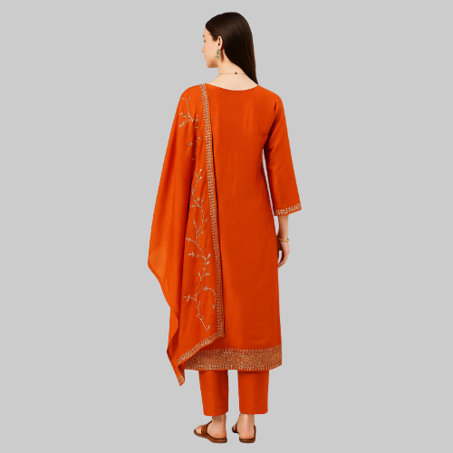 Orange traditional outfit with embroidered details on a white background
