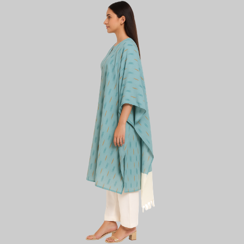 Woman wearing a light blue traditional outfit with white pants on a white background