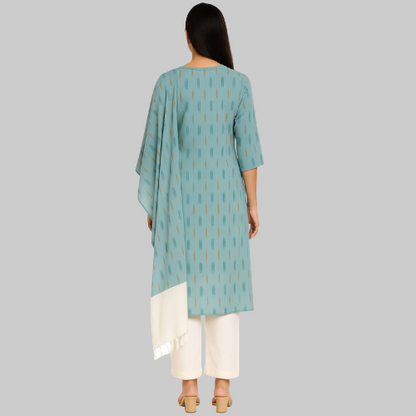 Woman wearing a light blue patterned kurta with white pants on a white background