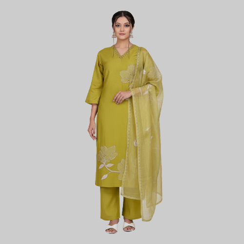 Woman wearing a green traditional outfit with a matching dupatta on a white background