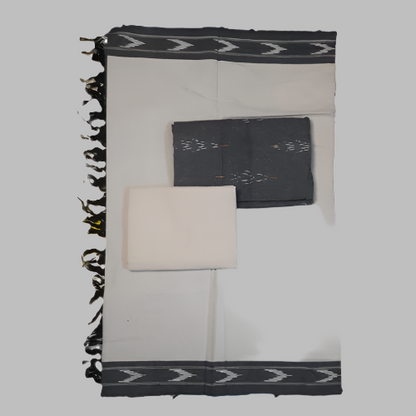 Black and white patterned fabric with folded black and white items on a white background