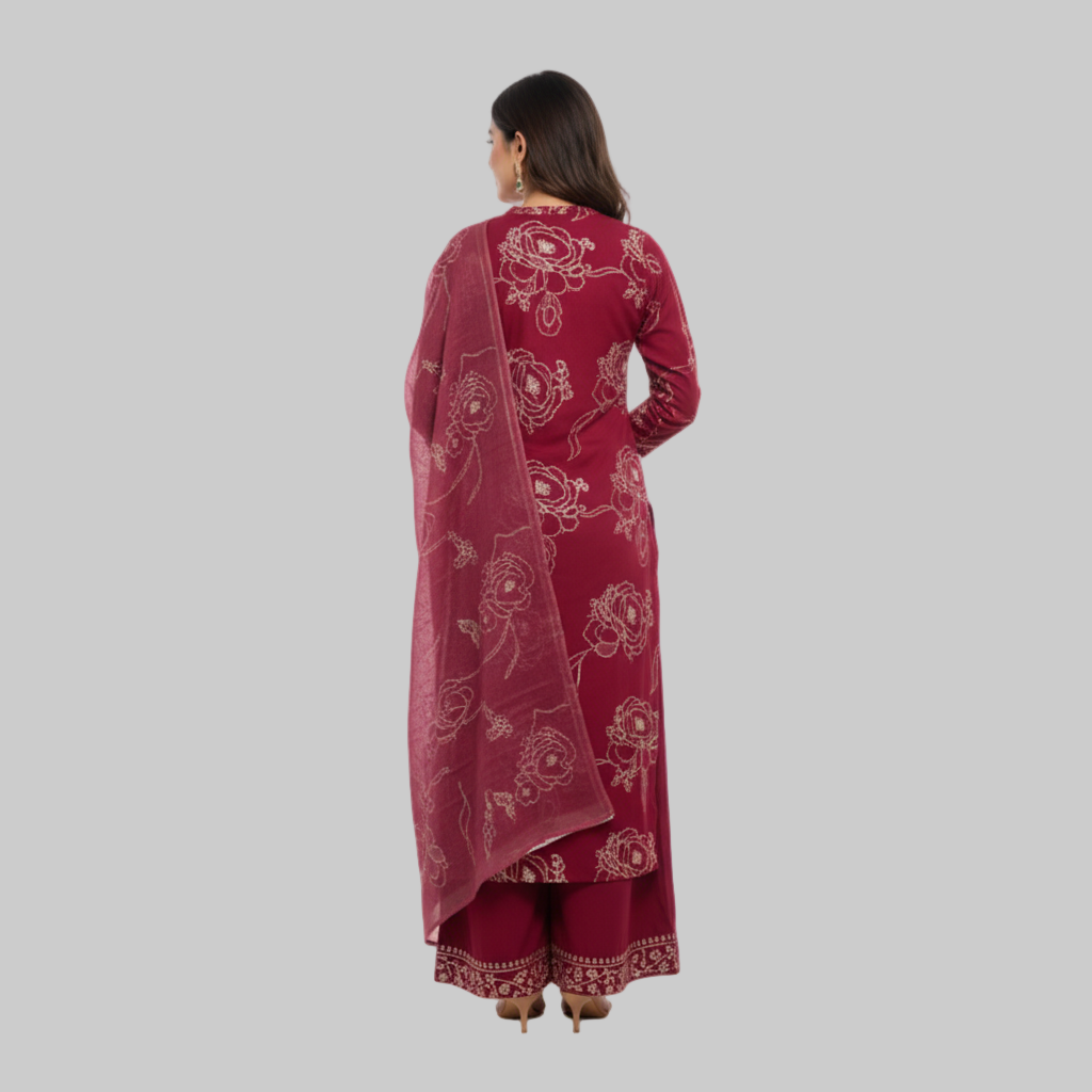 Woman wearing a maroon traditional outfit with a matching dupatta on a white background