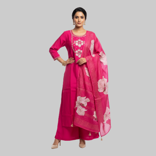 Woman wearing a pink traditional outfit with floral patterns on a white background