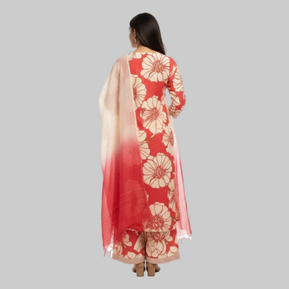 Woman wearing a red and white floral dress with a matching dupatta on a white background