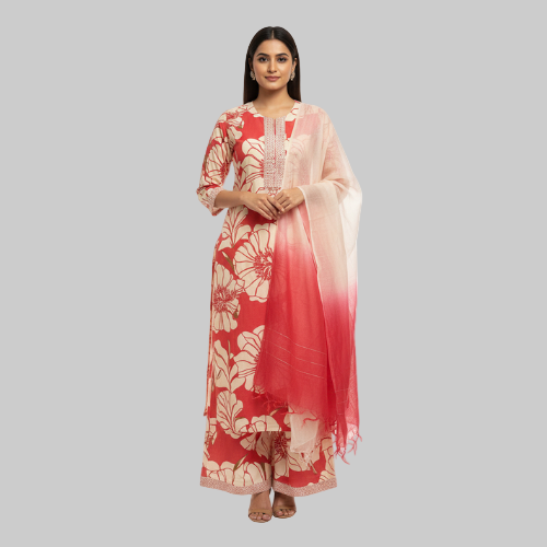 Woman wearing a red and white floral dress with a matching dupatta on a white background