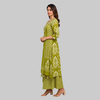 Woman wearing a green patterned kurta with matching pants on a white background