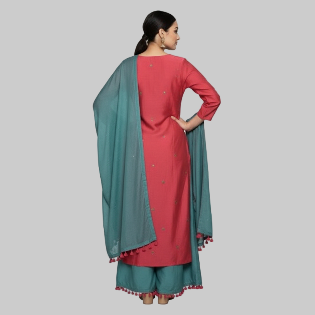 Woman wearing a red and teal traditional outfit with a matching dupatta on a white background