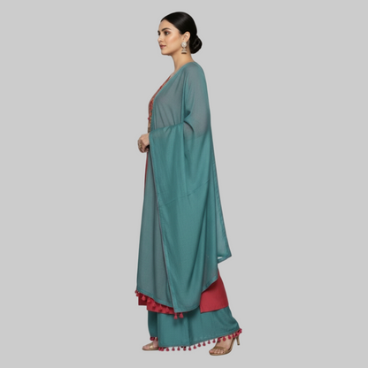 Woman wearing a red and teal traditional outfit with a matching dupatta on a white background