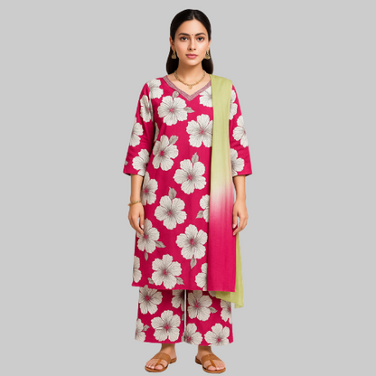 Woman wearing a pink floral dress with a green dupatta on a white background