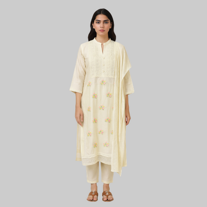 Woman wearing a cream-colored kurta with floral embroidery on a white background