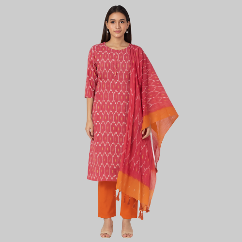 Woman wearing a red and orange traditional outfit with a matching dupatta on a white background