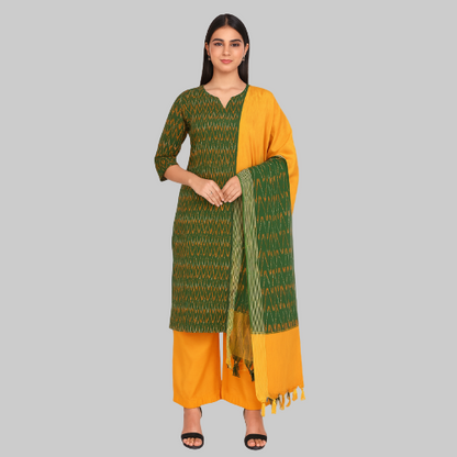 Woman wearing a green and yellow traditional outfit with a matching dupatta on a white background