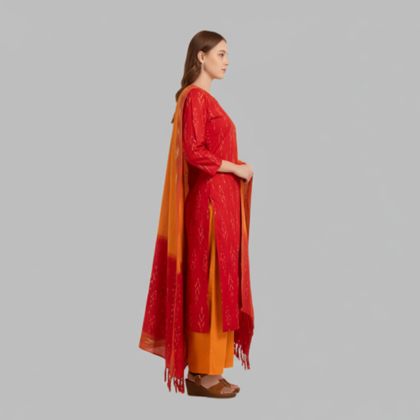 Woman wearing a red and orange traditional outfit on a gray background